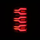 AlphaRex 19-21 Dodge Ram 1500 Luxx-Series LED Tail Lights Black/Red with Activ Light/Sequential Signal